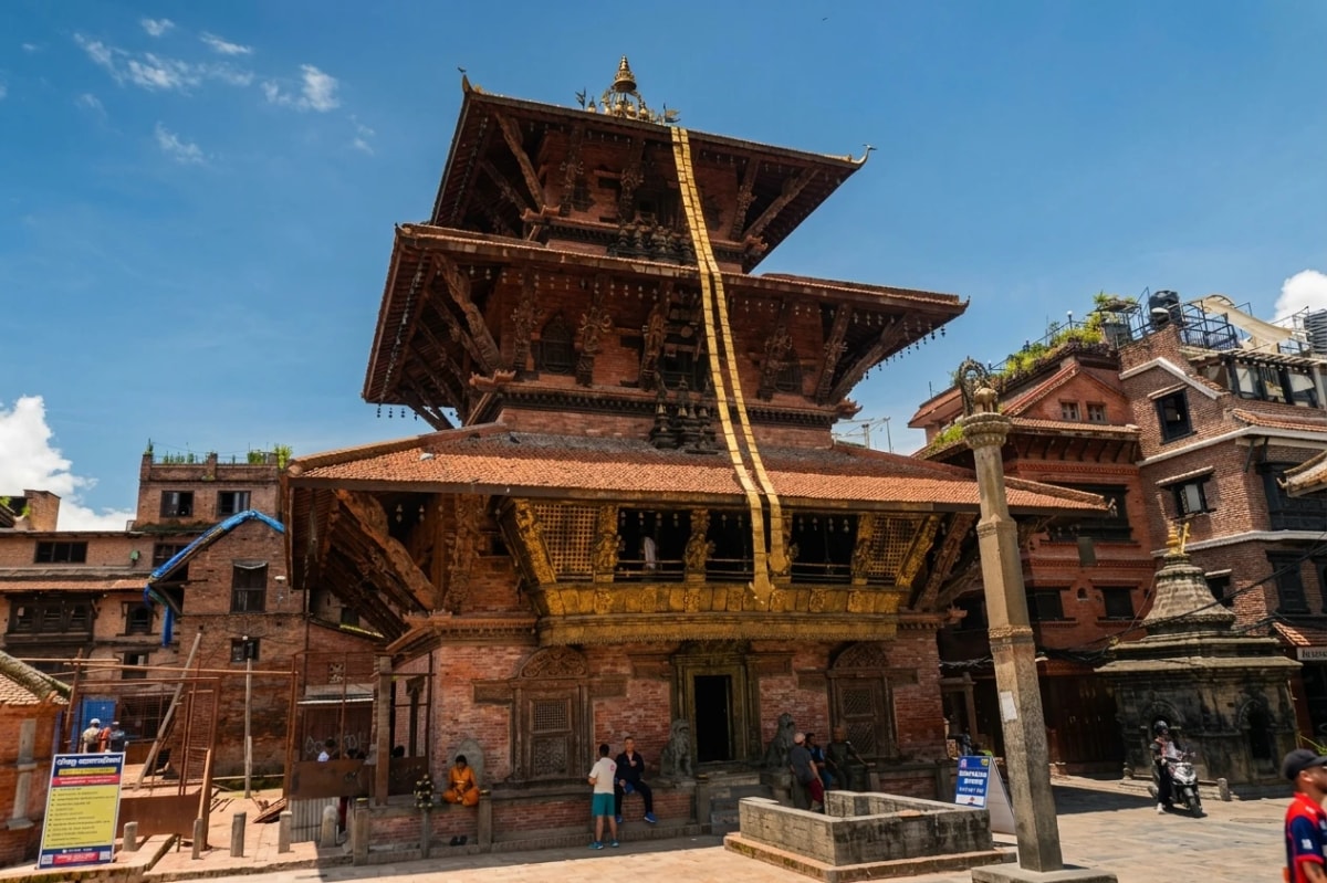 Bhimsen Temple in Patan, Nepal, featuring a traditional multi-tiered pagoda roof and intricate Newari architecture.