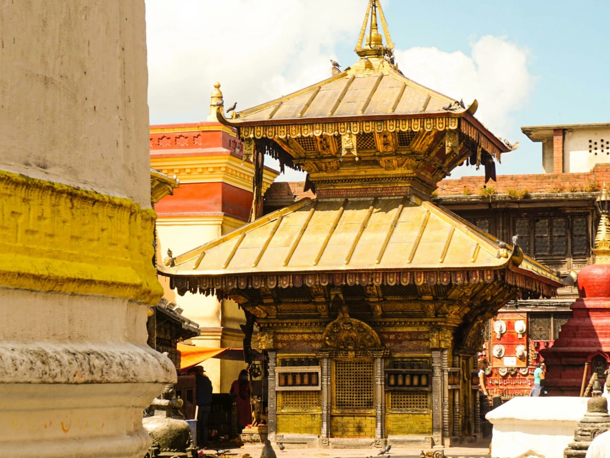 Harati Ajima Temple in Swayambhunath surrounded by courtyard shrines and structures.