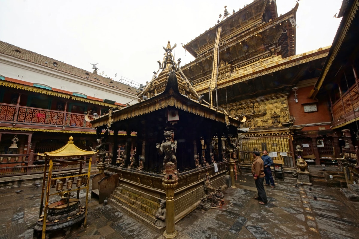 Golden Temple in Patan, featuring Buddhist shrine, gilded decorations, and traditional Newari courtyard architecture.
