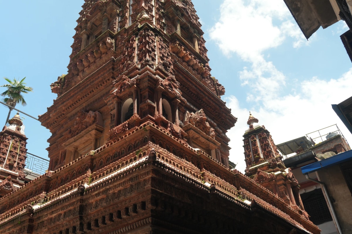 Mahabuddha Temple in Patan, Nepal, showcasing intricate terracotta carvings and traditional Buddhist architecture.