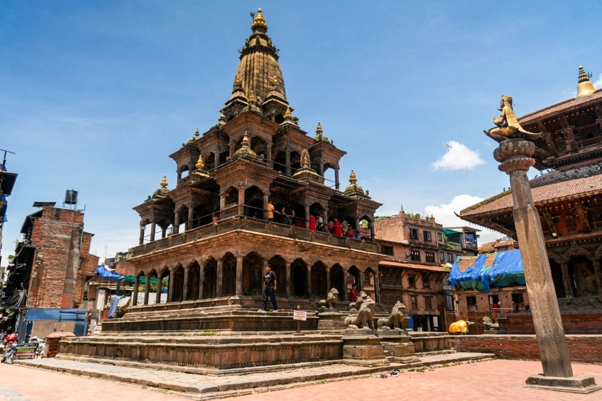 Krishna Mandir, a traditional stone temple with intricate Newari architecture in Patan Durbar Square, Lalitpur, Nepal.